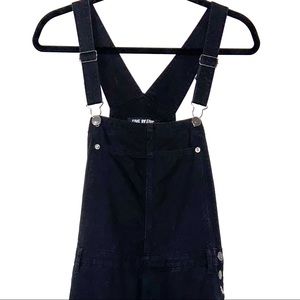 Black overalls with distressed legs
